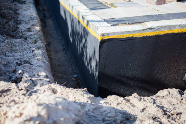 Professional Exterior Waterproofing technician working in Saranac, MI